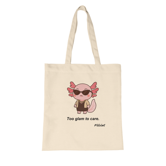 Front side of a beige tote bag featuring a stylish pink axolotl character wearing sunglasses and jewelry, with the text ‘Too glam to care.’ printed below.