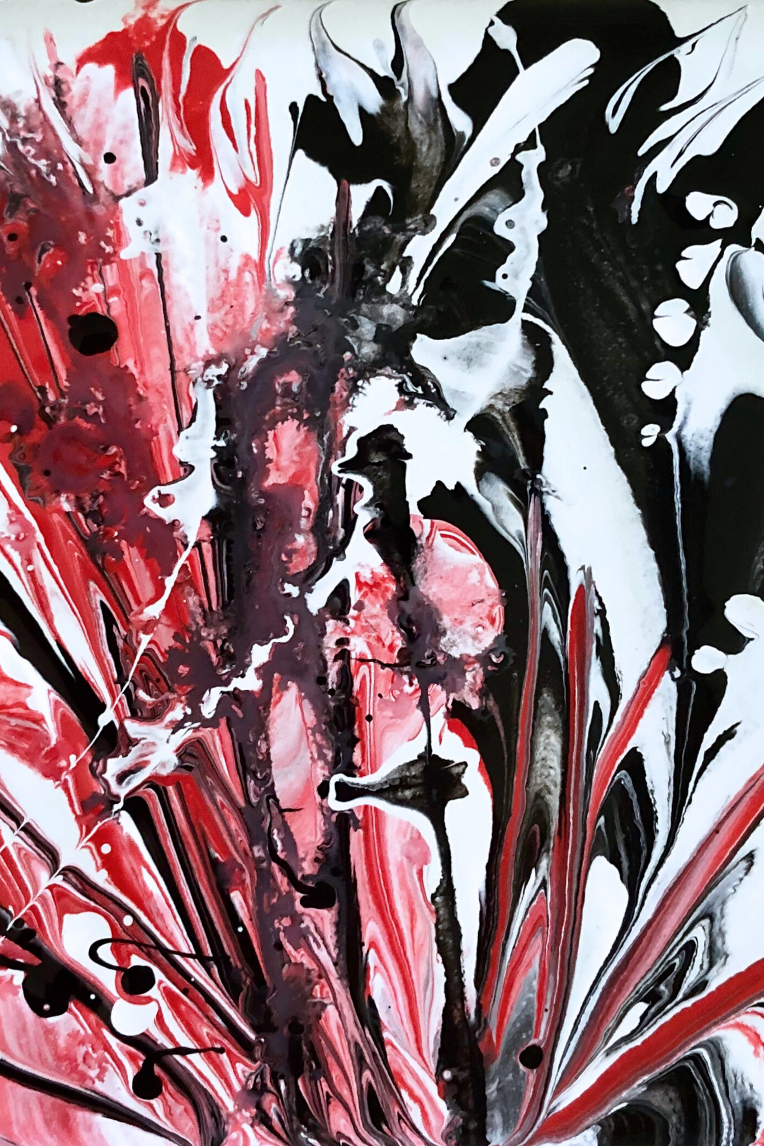 Abstract close-up of swirling red, black, and white acrylic paint, expressing inner tension and emotional chaos through fluid movement and layered textures.