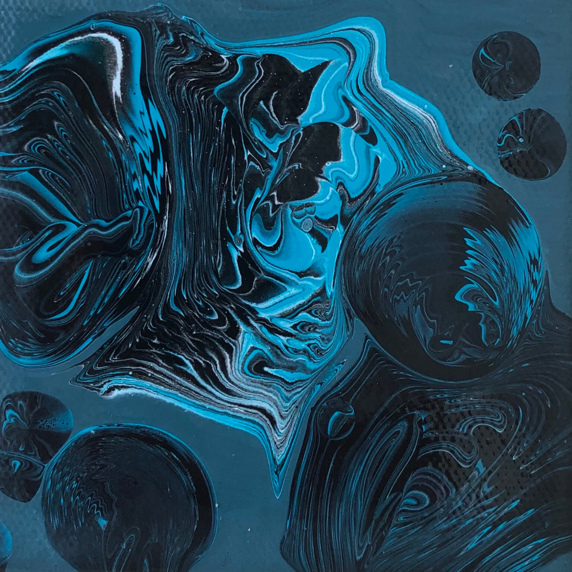 Abstract painting with fluid blue and black forms flowing across a dark teal background, featuring marbled textures and soft circular shapes that appear suspended, creating a sense of depth and weightlessness.